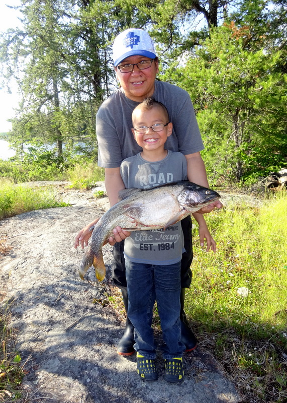 Adam's catch was almost as big as he was. 